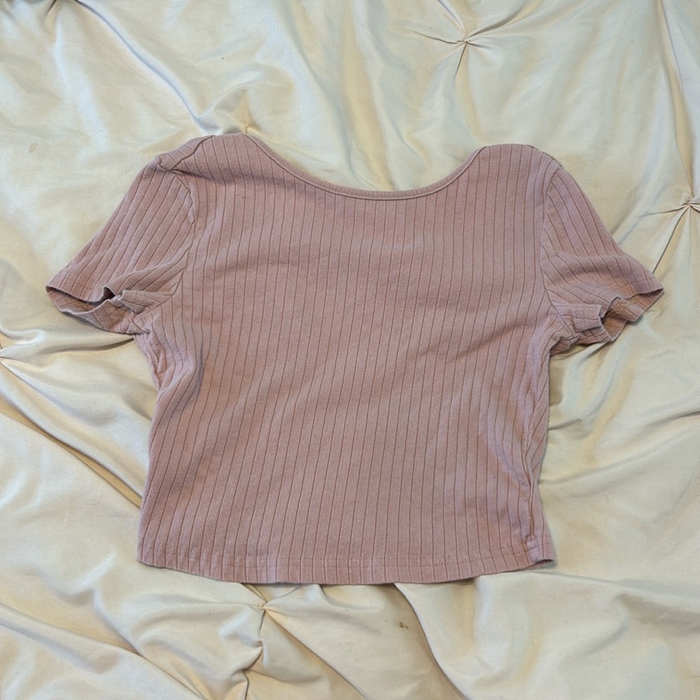 Light pink open back crop top.